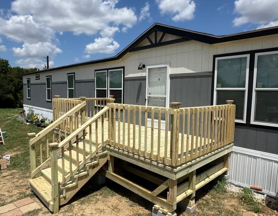 Portable pressure treated deck with stairs on blocks